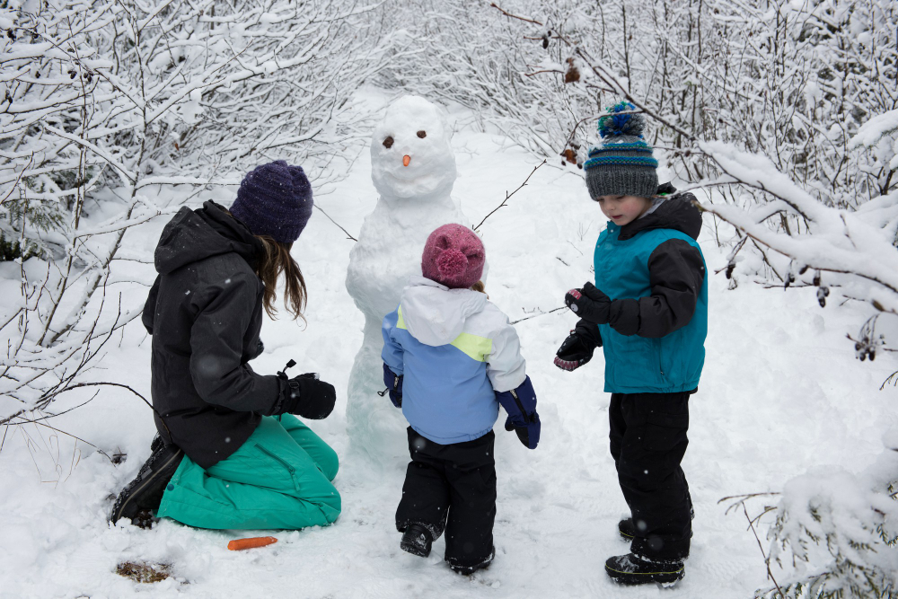 mother-with-children-making-snowman.jpg