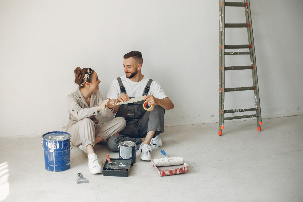 the-young-and-cute-couple-repairs-the-room.jpg