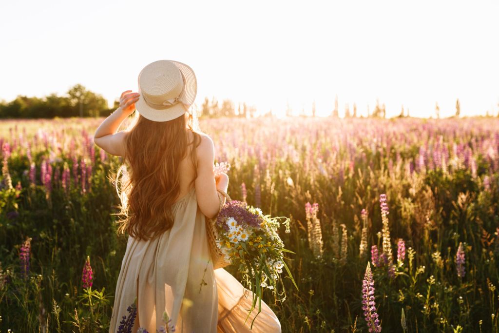 young-woman-in-straw-hat-and-dress-with-bouquet-of-lupine-flowers.jpg