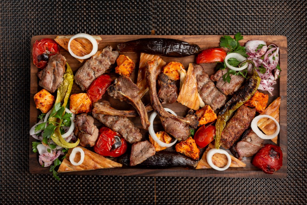 assorted-meat-kebab-with-onions-herbs-and-grilled-vegetables.jpg